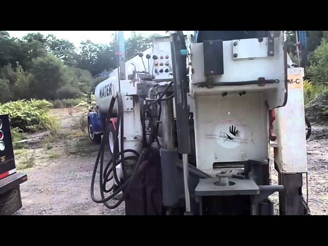 A small asphalt mill used to trim areas that the large mill can not reach