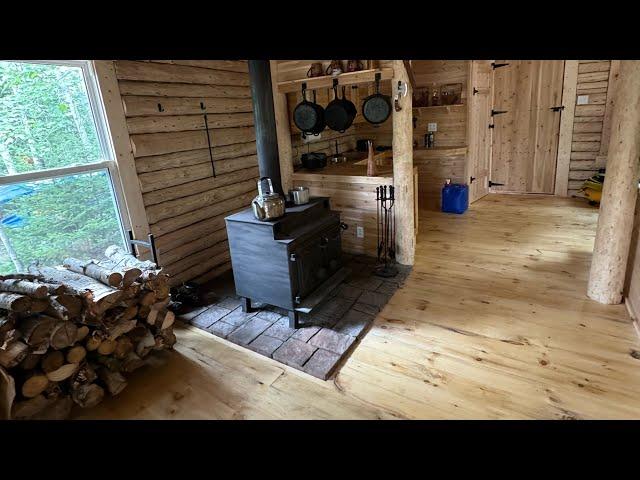 Log Cabin built in the North, got the wood stove ready, wood inside the Cabin,