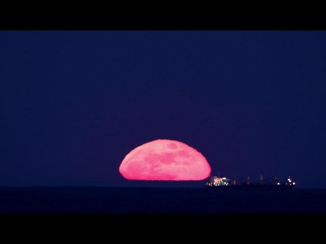 Full Moon Rises Above Ocean