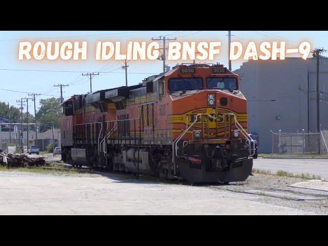 A ROUGH idling BNSF dash-9 sits as it waits for a grain train to be loaded