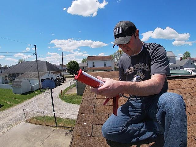 How to seal down a wind damaged roof shingle.