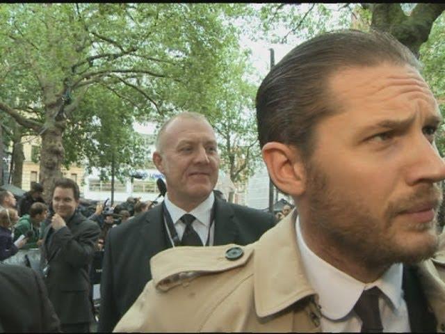 Tom Hardy kicks off with reporter at The Dark Knight Rises premiere, London