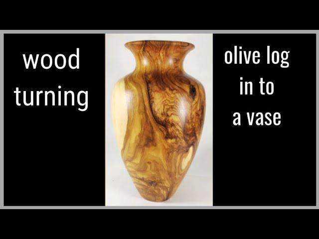 Wood turning a olive log in  to a vase