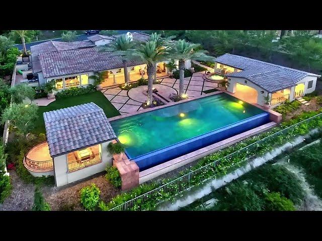 Spanish Style Backyard with Vanishing Edge Swimming Pool