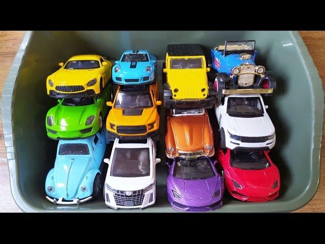 Box Full of model cars : Porsche, Tesla, Peugeot, Volvo, Close-up toy car review Tomica L108