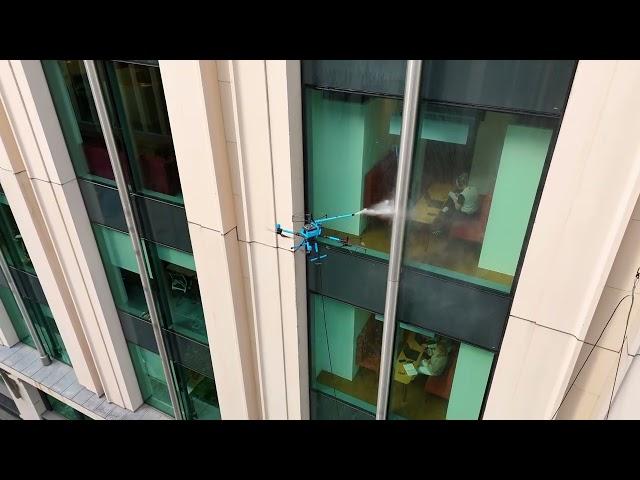 KTV Working Drone England cleaning windows on stunning building