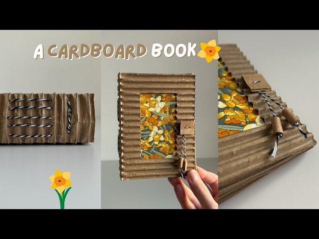 a handmade book made out of cardboard  bookbinding with quiet music