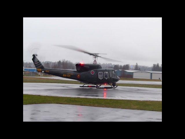 Bell 212 Helicopter Takeoff Rainy Day