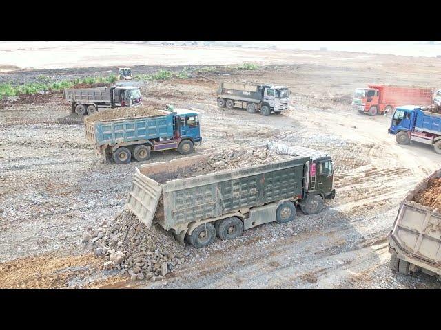 Nonstop Progress Bulldozer Working Hard Pushing Rock Dirt Dump Truck Unloading