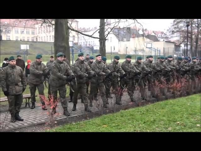 Polish Soldier Gets Hat Shot Off