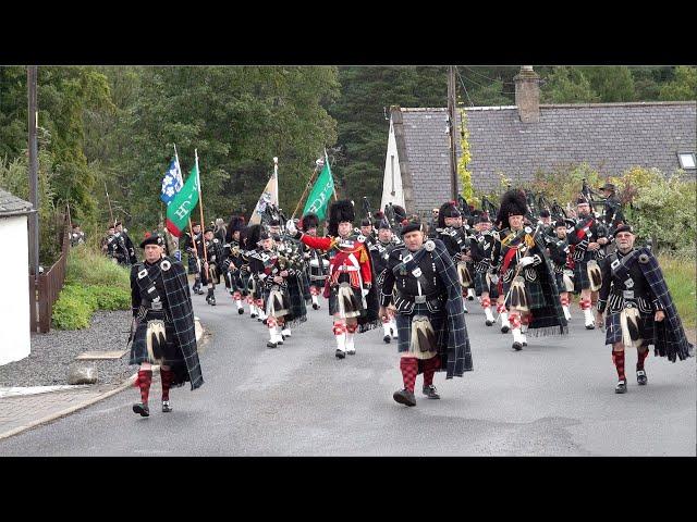 Lonach Highlanders march through Strathdon in the Cairngorms, Scotland during 2023 Lonach Gathering