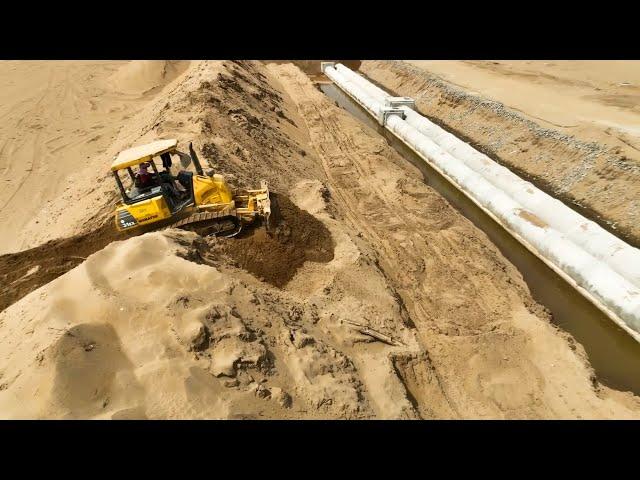 Great Activity Small Bulldozer Clearing Sand Fill On The Drains On a Big Land