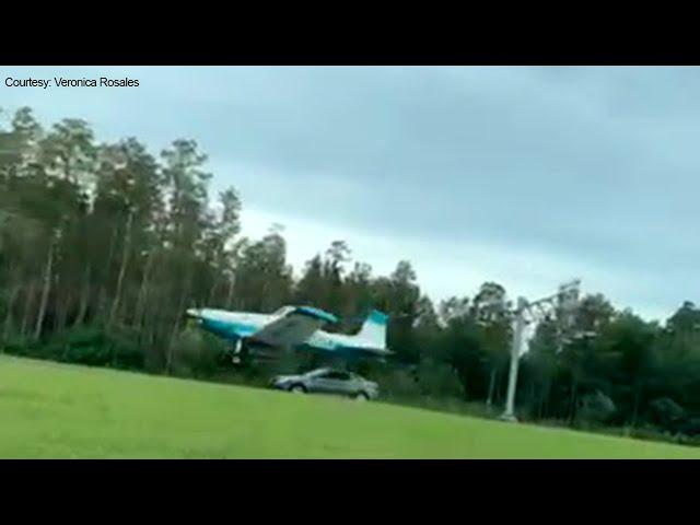 Motorist's video shows plane land along Tampa road