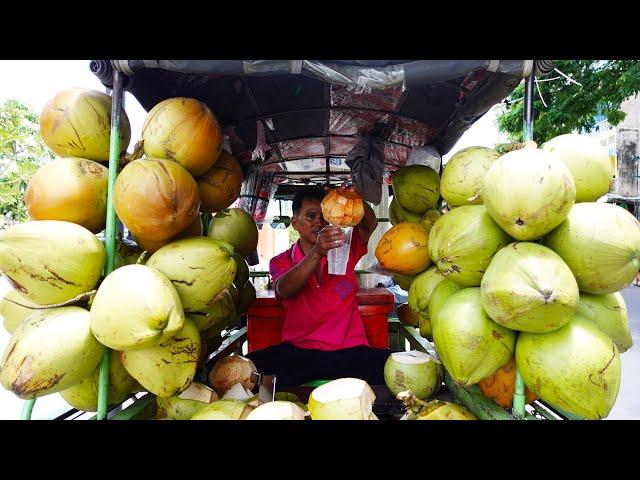 Cutting Coconuts As Fast As A Machine By An Old Man Sell On The Street In Phnom Penh City