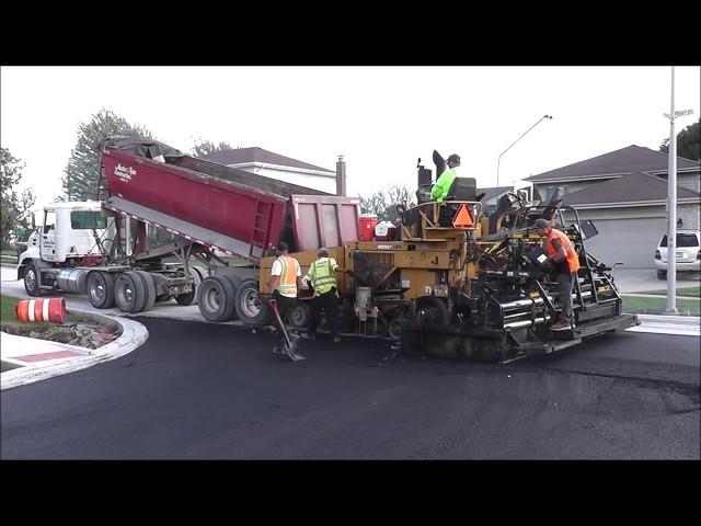 Paving Asphalt Road With CAT Paver Machine Asphalt Paving Crew In Action