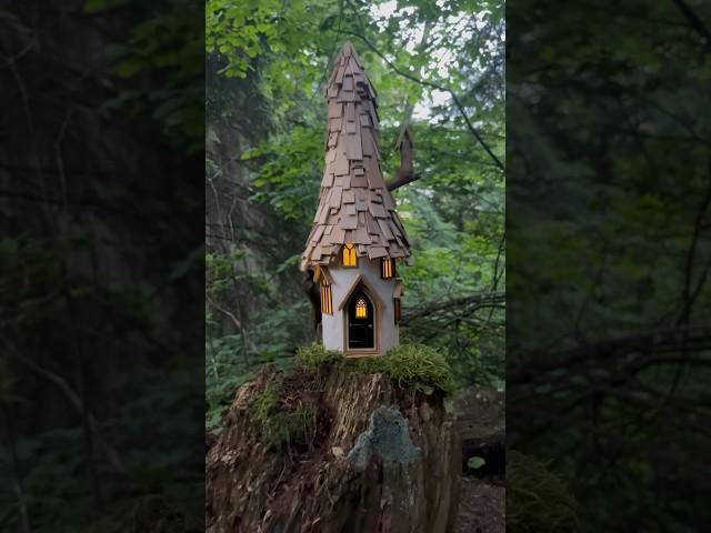 A fairy house crafted from a recycled bottle