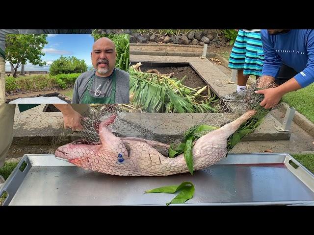 Chef Eddie cooking kalua pig in an imu.