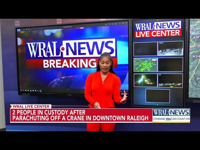 Two parachute off crane in downtown Raleigh, police say