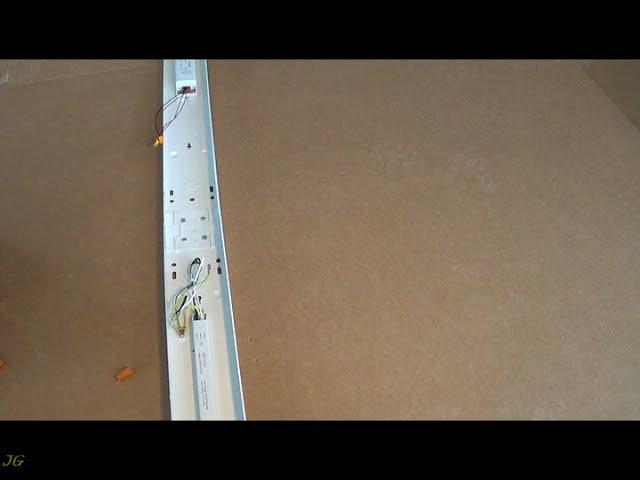 Connection of Metalux or similar strip light fixtures for row mounting.