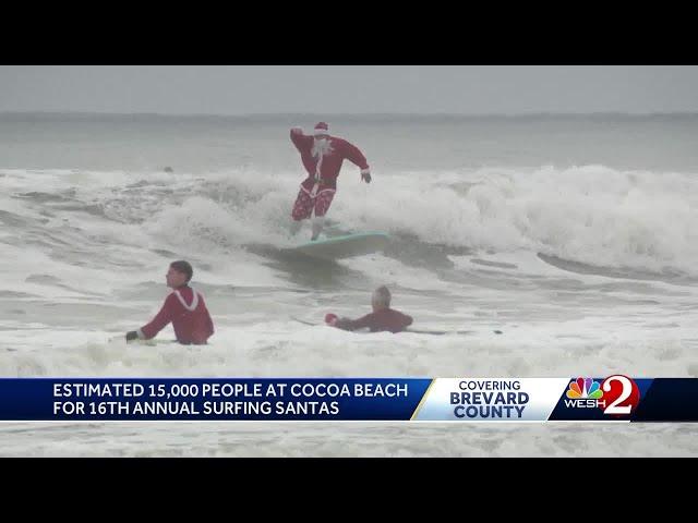 Surfing Santas hit waves at Cocoa Beach on Christmas Eve for 16th year