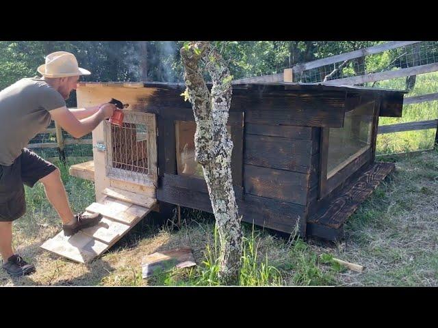 The man lives alone in a cabin in the mountain village, cooks and builds a shelter for rabbits.