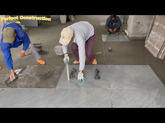 Construction And Installation Of Luxurious Ceramic Tiles For The Living Room Floor Using A Vibrator