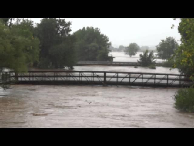 Flood Waters Crest the Banks of the South St Vrain in Longmont, CO