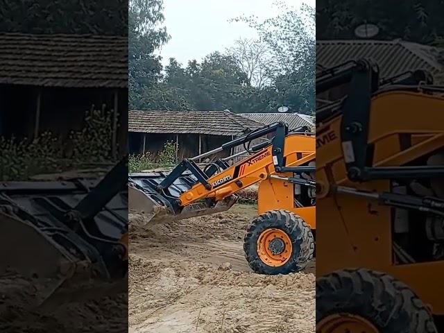 JCB machine working leveling mud