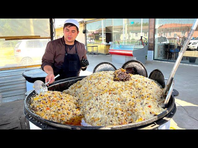 Popular Uzbek pilaf in a large kazan I National Uzbek food