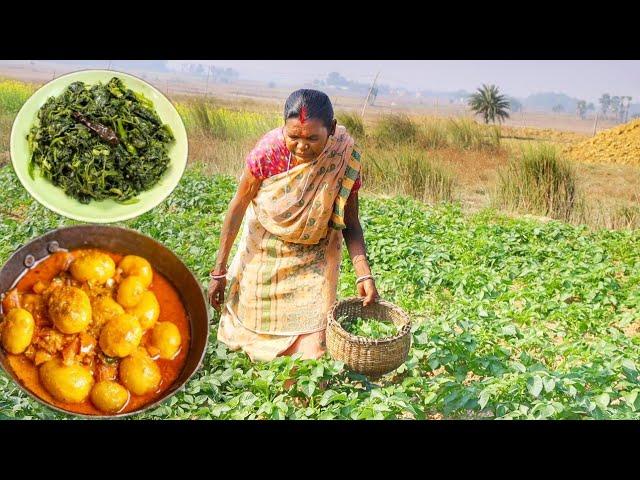 Santali tribe grandmaa collect Potato Shak for cooking shak vaji and Mutton fat potato curry