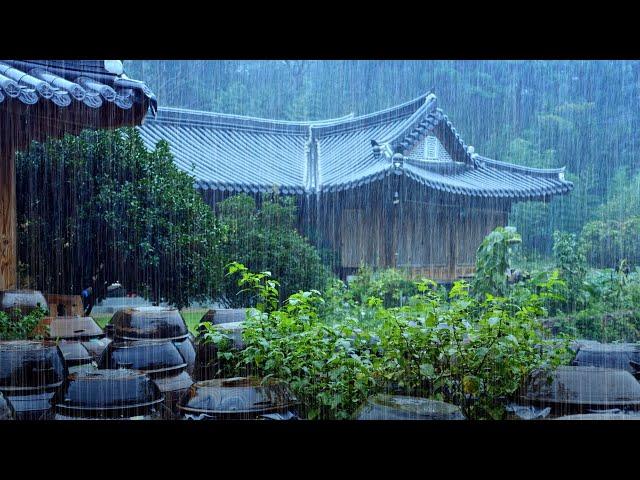 Heavy rain falls on a hanok house