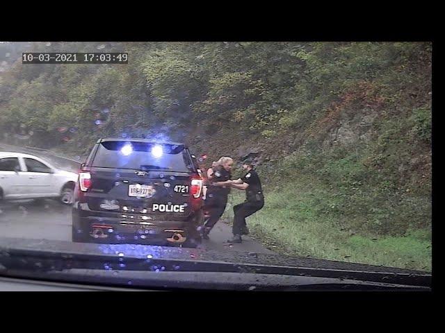 Virginia policeman saves fellow officer from oncoming car