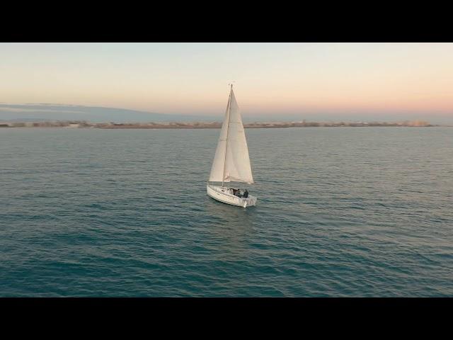 videoblocks aerial view the yacht sails on the sea at sunset drone flies around the yacht with sails