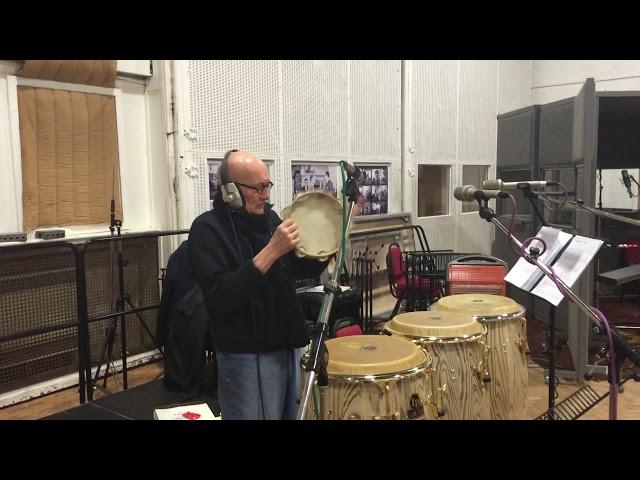 Ray Cooper plays the tambourine.