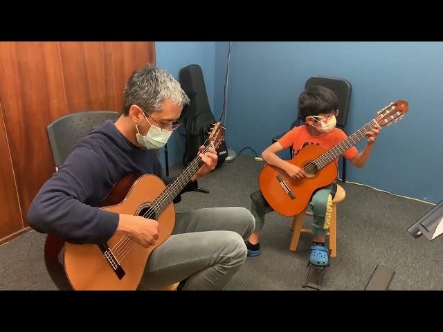 Rob Watson with Student playing May Song