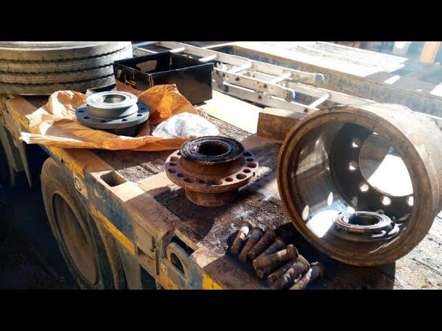 Renewing SAF axle hub, studs, nuts and rims on Nooteboom 4 axle lowloader trailer on site