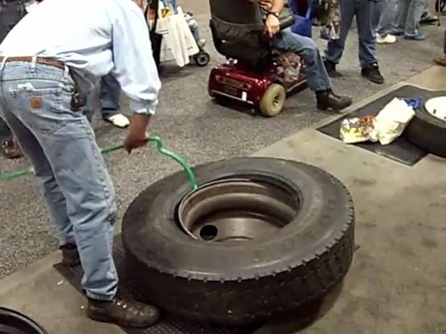 Using Ken-Tool's Serpent bar to demount an 11R22.5 truck tire at MATS 2010 in Louisville.