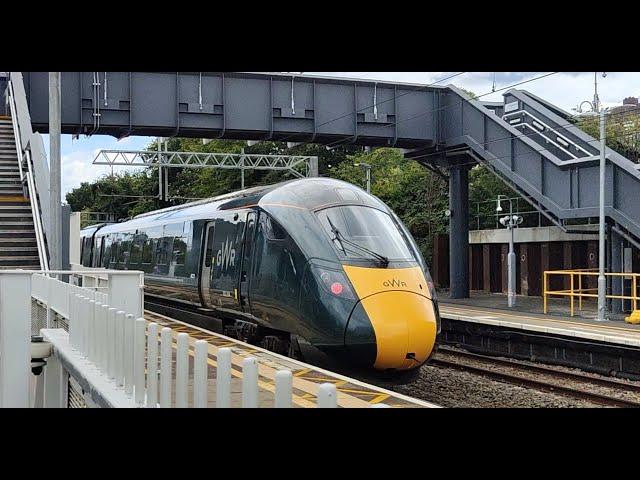 Variety of trains speeding through Ealing Broadway