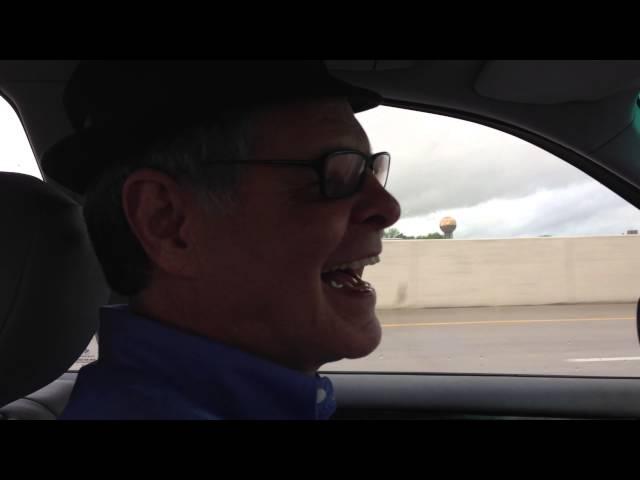 Rich Neubert Smiling and Driving