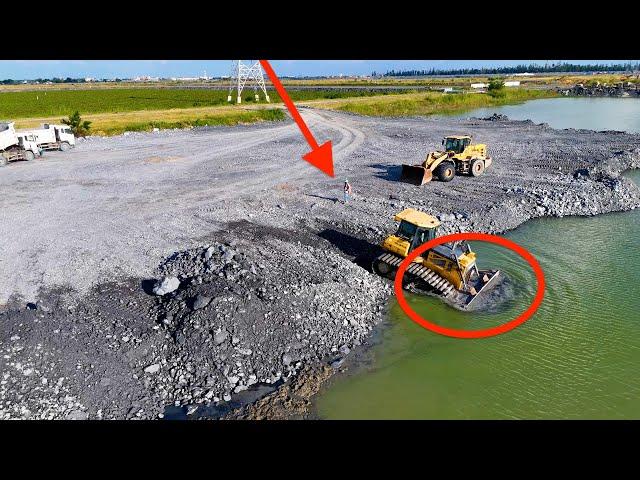 Full Video ,battery action on the project! Pour rocks into a large lake using a trucks &Wheel loader