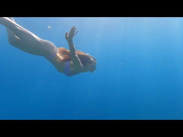 Girl dives without a mask. Mediterranean Sea 