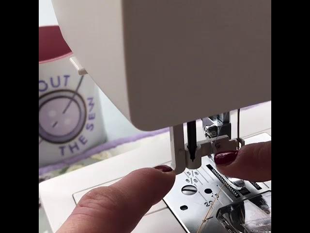 How to use the automatic needle threader on a Janome sewing machine