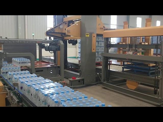 Gantry palletizer for film shrink wrapped bottles