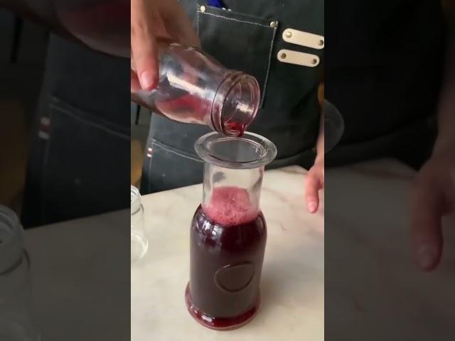 Experience the exquisite blend of hibiscus and white grape in every drop