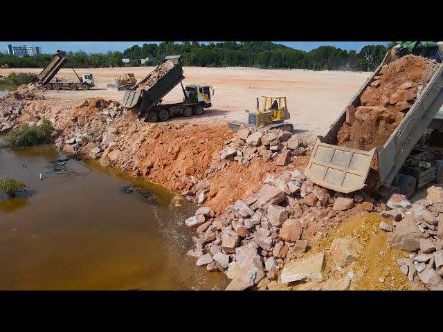 Great Team Work Hard Land Filling Up Use Operator Bulldozer Push Stone , Dump Truck Unloading Stone