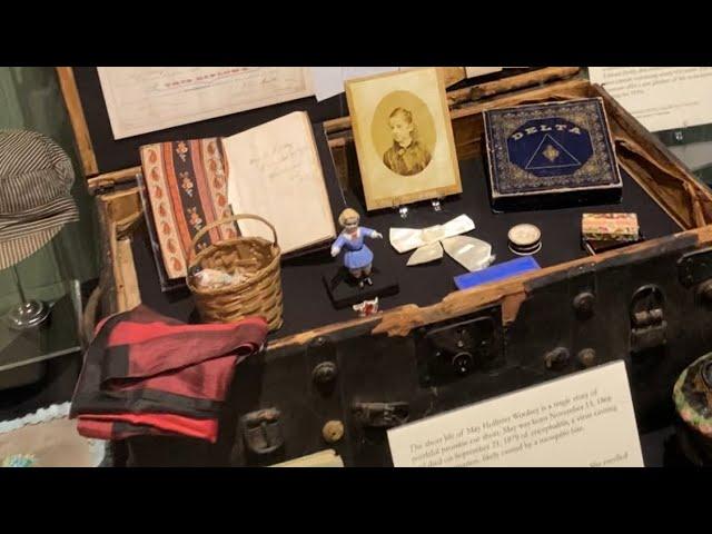 May Hollister Woolsey and her trunk at the Sacramento History Museum