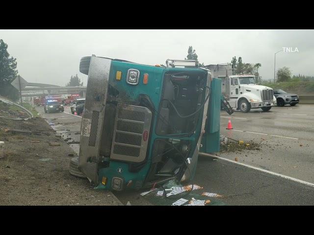 Garbage Truck Overturns on LA Freeway