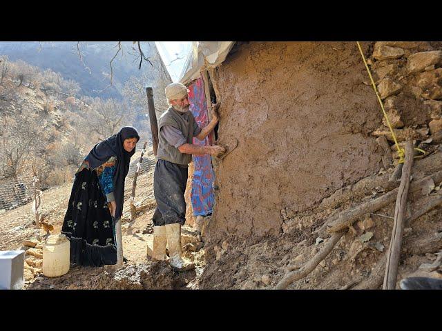 Iran nomadic life: Jahangir finished the front walls of the shelter with mud and straw