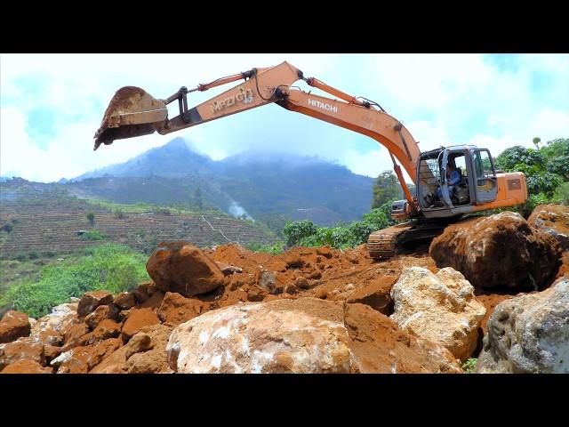 Hitachi Excavator Digging Rock And Dirt On The Hill