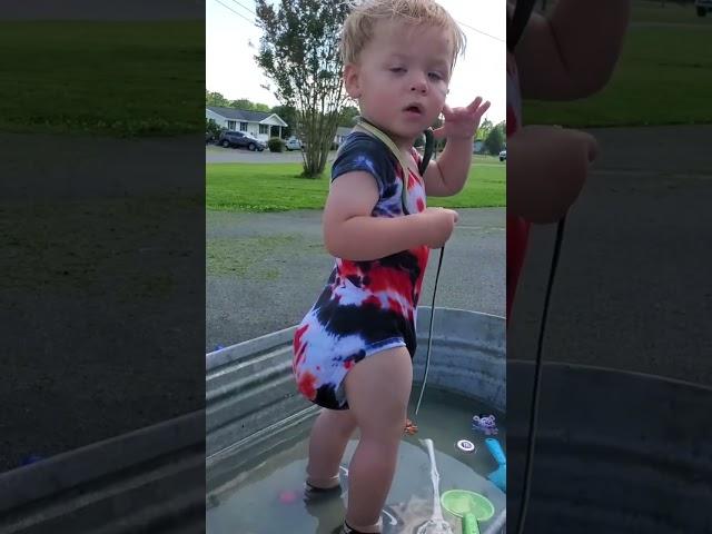 Little One Splashes in Water Trough#ToddlerFun #WaterPlay #KidsActivities #OutdoorFun